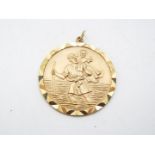 A 9ct gold St Christopher pendant, 3.5 cm (d), approximately 12.5 grams all in.