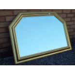 A gilt framed over mantel mirror measuring approximately 70 cm x 101 cm