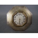 An Edward VII desk clock with octagonal, hallmarked silver surround with engine turned decoration,