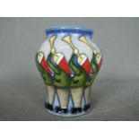 Moorcroft - a Moorcroft Eleven Pipers Piping vase,