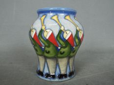 Moorcroft - a Moorcroft Eleven Pipers Piping vase,
