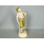 A large Royal Dux figurine depicting a standing fisher man holding a pipe and net,