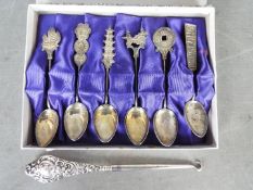 A set of six Chinese coffee spoons (presumed silver) and a silver handled button hook.