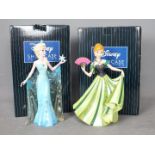 Two Disney Showcase Collection figurines comprising Anna and Elsa from Frozen,