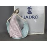 Lladro - A boxed figurine entitled Spring Dance, # 5663, approximately 23 cm (h).
