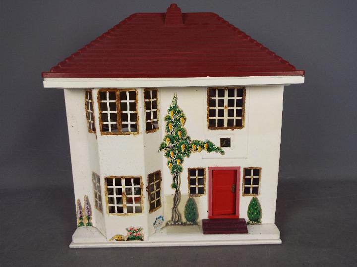 Three scratch built wooden dolls houses. Click on photographs to view each house.