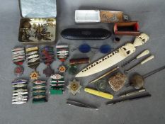 A mixed lot of collectables to include medals, pocket watch keys,