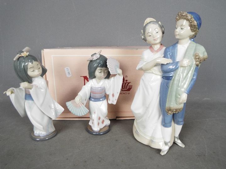 Two Lladro figurines comprising # 6230 Oriental Dance and # 6150 Playing The Flute (flute not