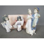 Two Lladro figurines comprising # 6230 Oriental Dance and # 6150 Playing The Flute (flute not