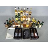 A collection of 33 whisky / whiskey miniatures comprising Tamnavulin 12 y/o, Bruichladdich 10 y/o,