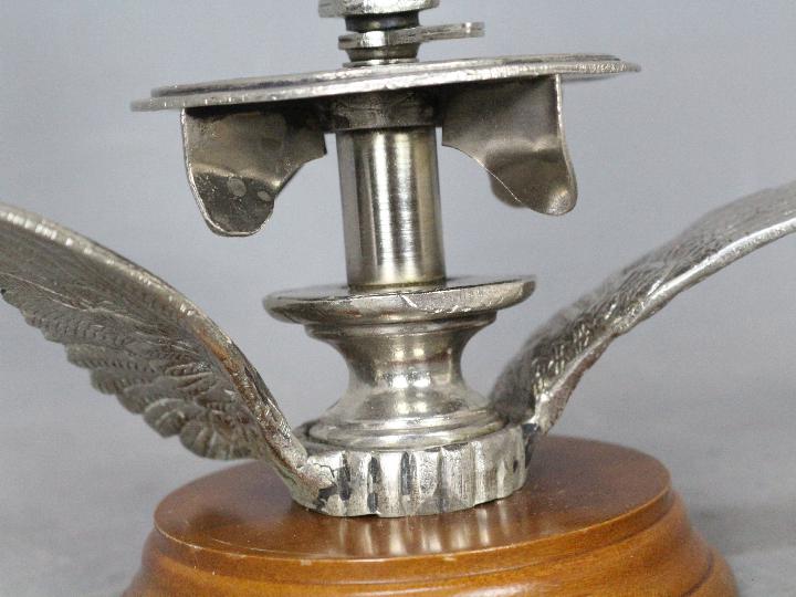 Automobilia - An unusual car mascot in the form of a pair of wings below a wind spun, numbered disc, - Image 3 of 5