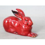 Royal Doulton - A small flambe rabbit, recumbent,