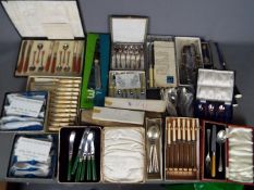 A collection of plated flatware and similar including cased sets.
