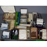 A collection of plated flatware and similar including cased sets.