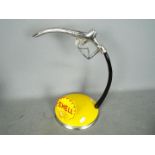 A Shell petrol pump handle,