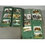 A collection of topographical early period postcards in 3 old albums.