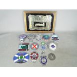 Automobilia - A collection of various car badges and a Rolls Royce advertising mirror.