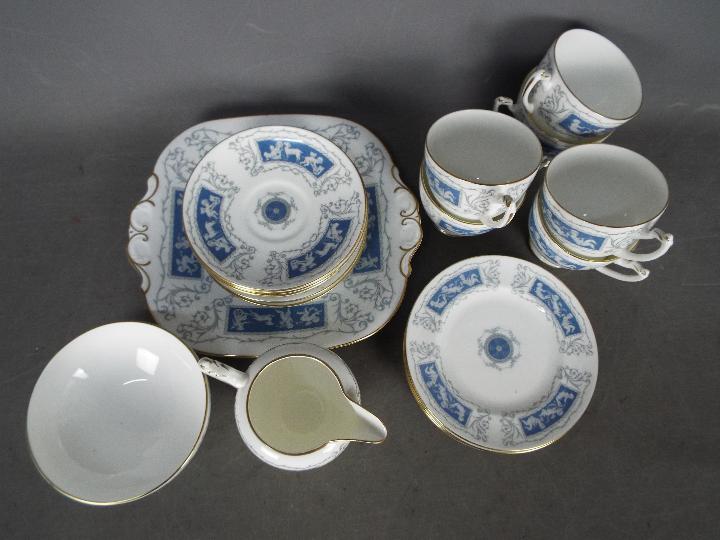 A Coalport Revelry tea service comprising six cups and saucers, six side plates, sugar bowl,