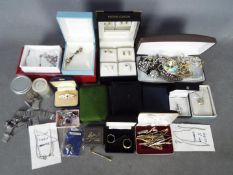 A quantity of costume jewellery, jewellery boxes and similar.