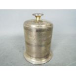 A George VI hallmarked silver cigarette box of cylindrical form,