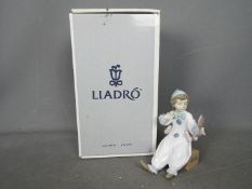 Lladro - A boxed figurine entitled Pierrot In Preparation, # 6257, approximately 15 cm (h).