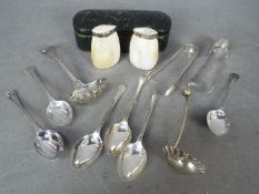 Lot to include six sterling silver coffee spoons, silver tongs with chased decoration,