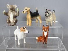 Beswick - Five unboxed animal figurines comprising Koala, fox, Airdale Terrier,