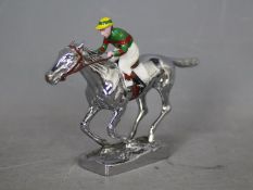 Automobilia - Louis Lejeune: a chrome car mascot in the form of a racehorse and jockey,