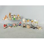 A collection of sixteen enamel / stone set trinket boxes,