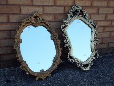 Two gilt framed oval mirrors,