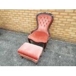 A button back bedroom chair with footstool,