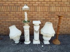 A collection of plant stands, lamps and similar.