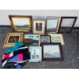 A collection of framed pictures and part frames.