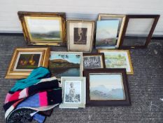 A collection of framed pictures and part frames.