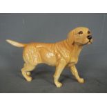 Royal Doulton - a Royal Doulton figure of a Golden Labrador, approx height 12 cm (h),