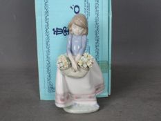 Lladro - A boxed figurine entitled May Flowers, # 5467,