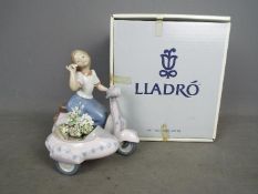 Lladro - A boxed figurine entitled Floral Getaway, # 5795,