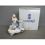 Lladro - A boxed figurine entitled Floral Getaway, # 5795,