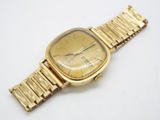 A gentleman's 9ct gold cased Rotary wristwatch on 9ct gold bark effect strap,