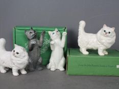 Beswick - Four cat figurines comprising two # 1898 Persian cat, one matte finish, one gloss,