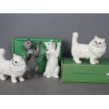 Beswick - Four cat figurines comprising two # 1898 Persian cat, one matte finish, one gloss,