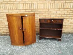 A bow fronted cabinet 94 cm x 67 cm x 44 cm and a two drawer hall cabinet 77 cm x 76 cm x 29 cm.