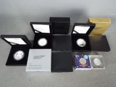 A set of three silver proof James Bond 007 commemorative .