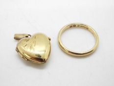 A 9ct gold wedding band, size J and a 9ct gold heart shaped locket pendant, approximately 3.