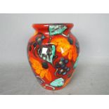 Anita Harris - A trial vase decorated with stylised flowers, signed in gold to the base,