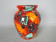 Anita Harris - A trial vase decorated with stylised flowers, signed in gold to the base,