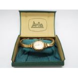 A 9ct gold cased Avia wristwatch on 9ct gold twin strand bracelet (15 cm length),