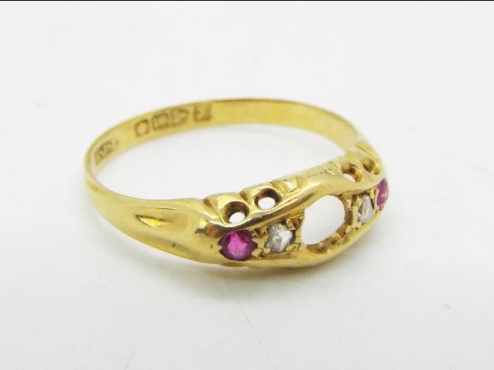 An 18ct gold stone set ring (central stone lacking), size P, approximately 2.4 grams all in.
