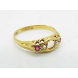 An 18ct gold stone set ring (central stone lacking), size P, approximately 2.4 grams all in.