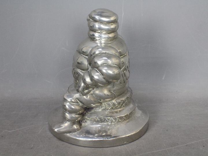 Automobilia - Bibendum: A chrome plated Michelin Man seated on two tyres and holding a spanner, - Image 4 of 6